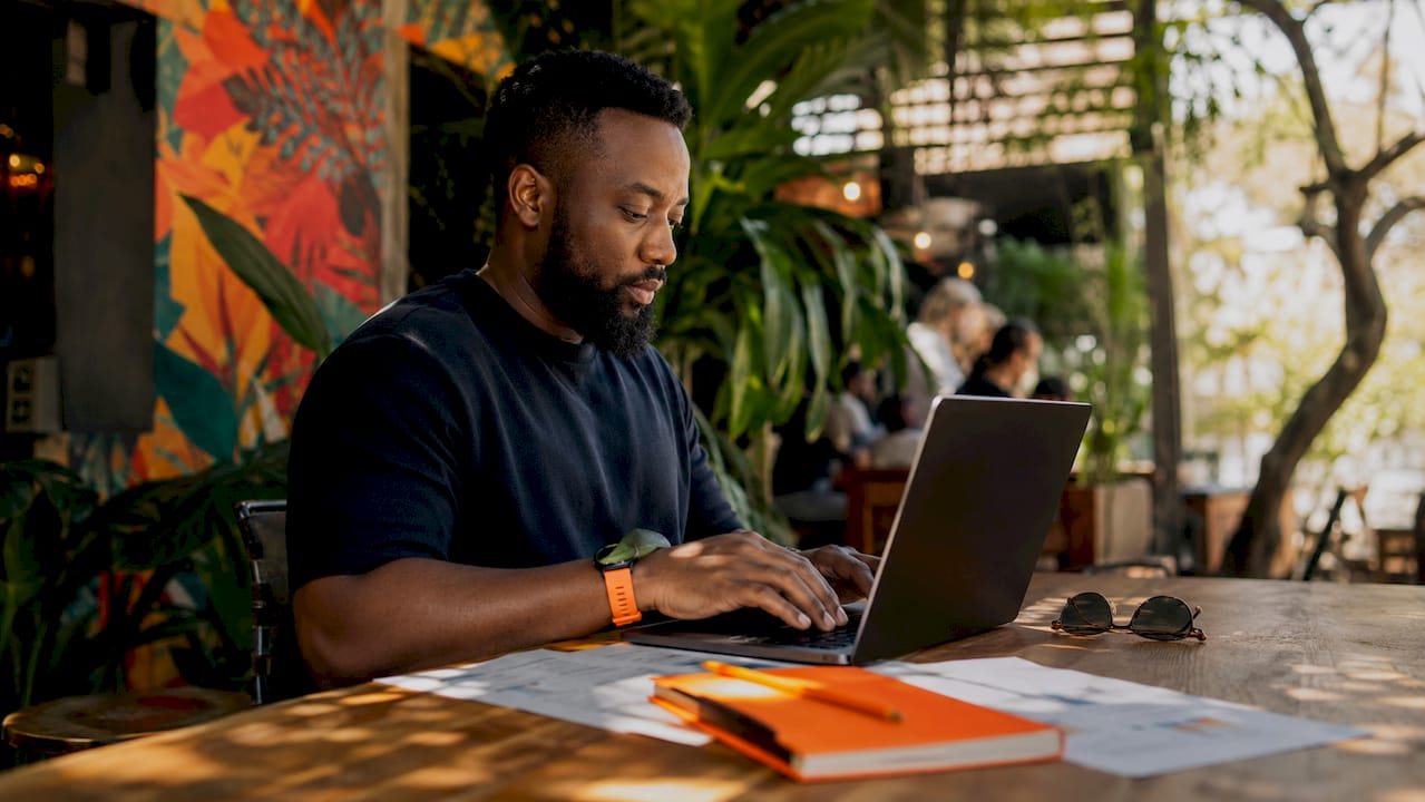 Marketer working on Google Ads campaign at home